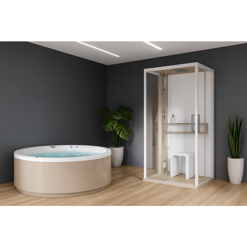 Moderne Dampfdusche Novellini Glax 2 A+F mit Glasfront neben rundem Hot tub in elegantem Wellnessraum mit Holzfußboden und Pflanzen.